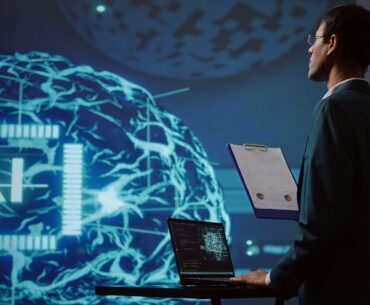 startup employee looking business charts using ai software scaled